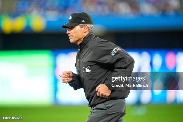 Umpire Angel Hernandez looks on as the Toronto Blue Jays play the Minnesota Twins in the sixth inning during their MLB game at the Rogers Centre on...