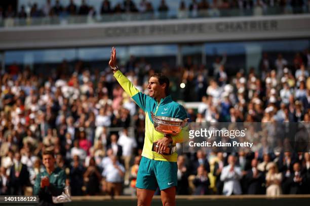Rafael Nadal of Spain celebrates with the trophy after winning against Casper Ruud of Norway during the Men's Singles Final match on Day 15 of The...