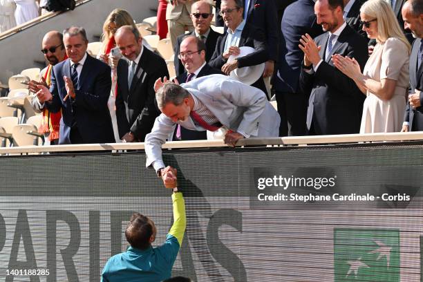 Rafael Nadal of Spain is congratulated by the King of Spain Felipe VI after winning the Men's Singles Final match against Casper Ruud of Norway, next...