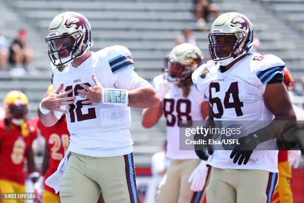 Paxton Lynch of the Michigan Panthers celebrates scoring a touchdown with Joshua Dunlop in the second quarter of the game against the Philadelphia...