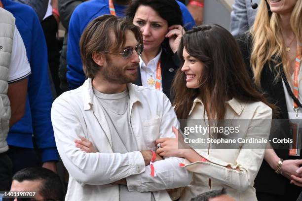 Emma Mackey and a guest attend the Men's Singles Final match on Day 15 of The 2022 French Open at Roland Garros on June 05, 2022 in Paris.