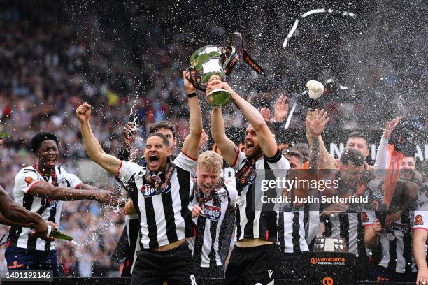 Giles Coke and Luke Waterfall of Grimsby Town lift the Vanarama National League Final trophy after their sides victory during the Vanarama National...