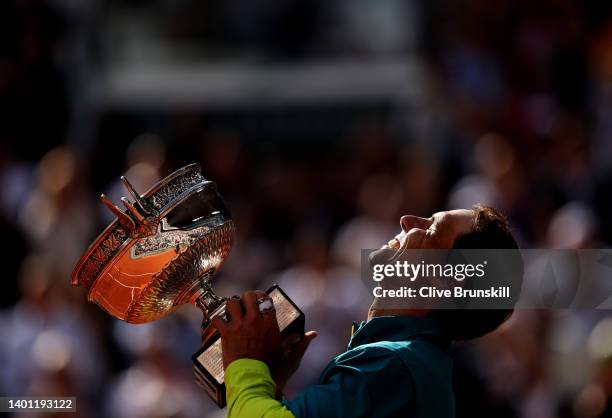 Rafael Nadal of Spain celebrates with the trophy after winning against Casper Ruud of Norway during the Men's Singles Final match on Day 15 of The...