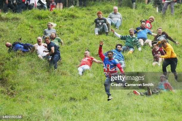 Chris Anderson takes part in the man's downhill race on June 05, 2022 in Gloucester, England. The Cooper's Hill Cheese-Rolling and Wake annual event...