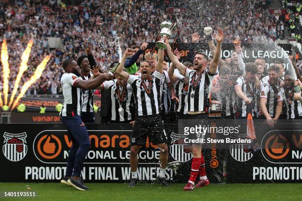 Giles Coke and Luke Waterfall of Grimsby Town lift the Vanarama National League Final trophy after their sides victory during the Vanarama National...
