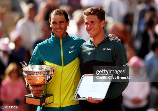 Rafael Nadal of Spain and Casper Ruud of Norway with their trophies after the Men's Singles Final match on Day 15 of The 2022 French Open at Roland...