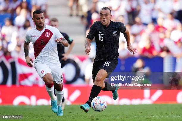 Clayton Lewis of New Zealand runs with the ball from Miguel Trauco of Peru during the international friendly match between Peru and New Zealand at...