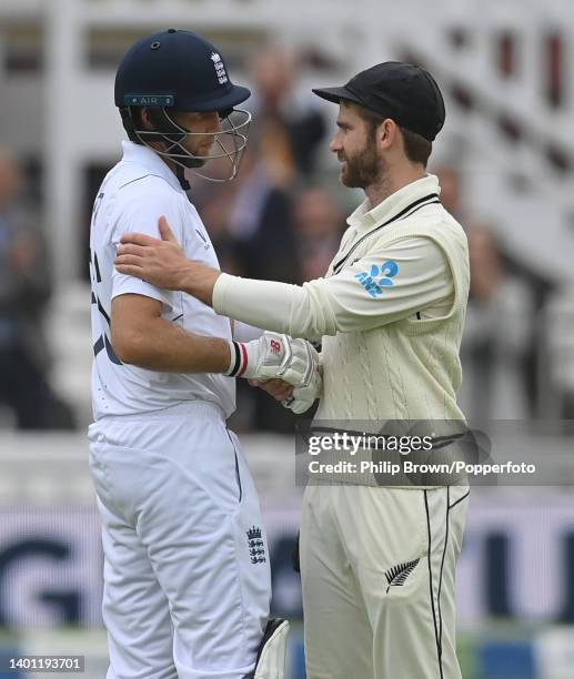 Joe Root of England is congratulated by Kane Williamson of New Zealand after England won the first Test at Lord's Cricket Ground on June 05, 2022 in...