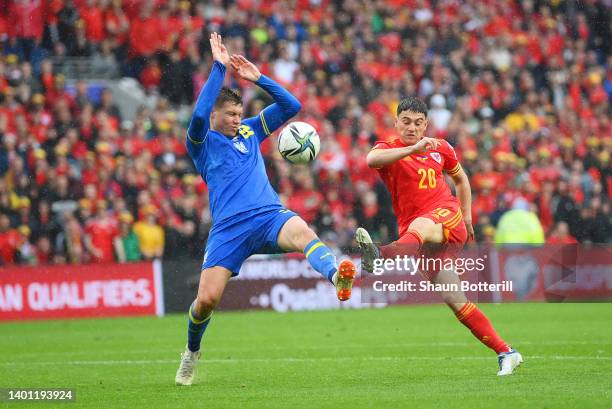 Daniel James of Wales shoots past Mykola Matviyenko of Ukraine during the FIFA World Cup Qualifier between Wales and Ukraine at Cardiff City Stadium...