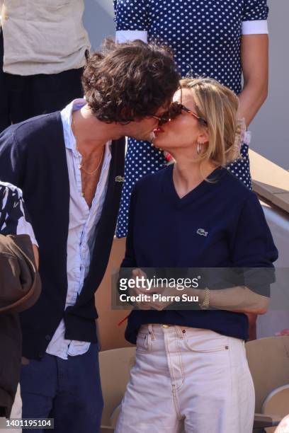 Oli Green and Sienna Miller are seen during the 2022 French Open at Roland Garros on June 05, 2022 in Paris, France.