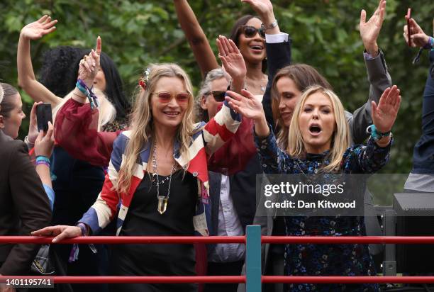 Kate Moss, Charlotte Tilbury and Naomi Campbell ride a bus along the mall during the Platinum Pageant on June 05, 2022 in London, England. The...