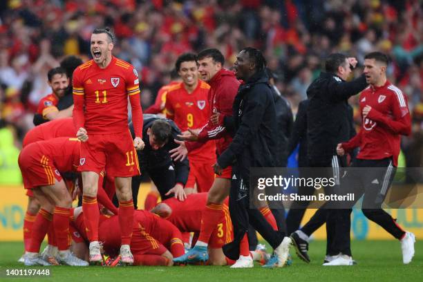 Gareth Bale of Wales celebrates with teammates after their sides victory, which qualifies Wales for the 2022 FIFA World Cup during the FIFA World Cup...