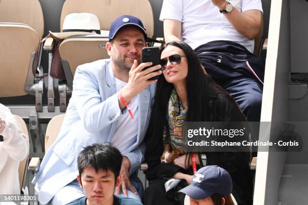 Chef Daniel Humm and Demi Moore with her dog attend the French Open 2022 at Roland Garros on June 05, 2022 in Paris, France.