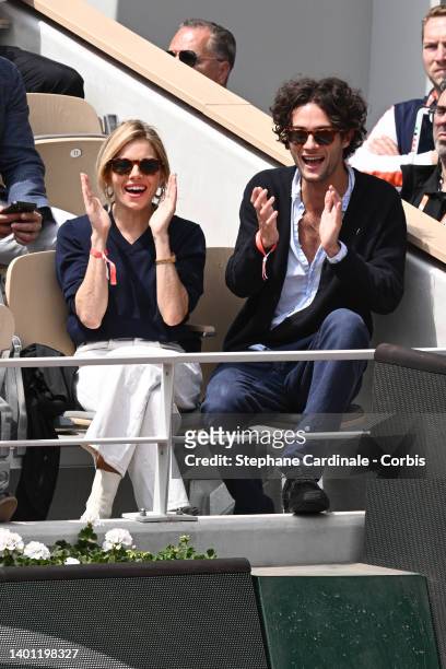 Sienna Miller and Oli Green attend the French Open 2022 at Roland Garros on June 05, 2022 in Paris, France.