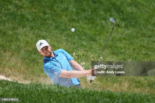 Daniel Berger of the United States plays a shot from a bunker on the fourth hole during the final round of the Memorial Tournament presented by...
