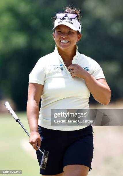 Megan Khang reacts after making a putt on the first green during the final round of the 77th U.S. Women's Open at Pine Needles Lodge and Golf Club on...