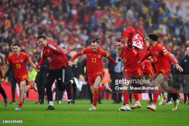 Gareth Bale of Wales celebrates with teammates after their sides victory, which qualifies Wales for the 2022 FIFA World Cup during the FIFA World Cup...