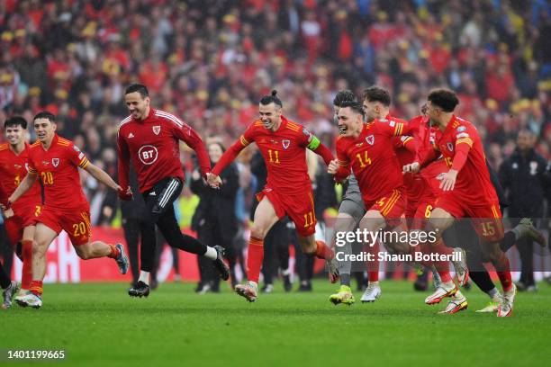 Gareth Bale of Wales celebrates with teammates after their sides victory, which qualifies Wales for the 2022 FIFA World Cup during the FIFA World Cup...