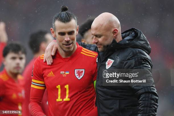 Gareth Bale celebrates with Rob Page, Head Coach of Wales after their sides victory which qualifies Wales for the 2022 FIFA World Cup during the FIFA...