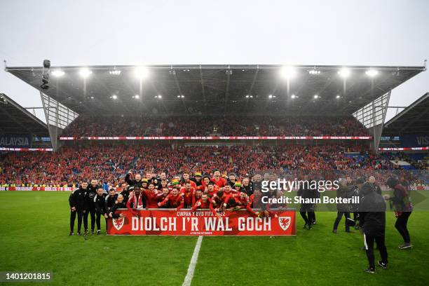 Wales players and staff celebrate after their sides victory which qualifies Wales for the 2022 FIFA World Cup during the FIFA World Cup Qualifier...