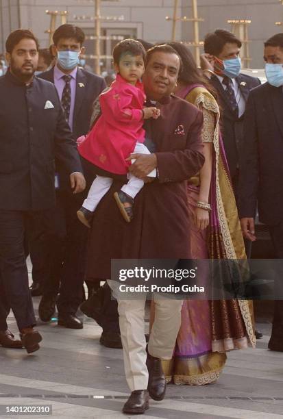 Mukesh Ambani and Prithvi Akash Ambani attend the Arangnetram ceremony of Ms. Radhika Merchant on June 05, 2022 in Mumbai, India