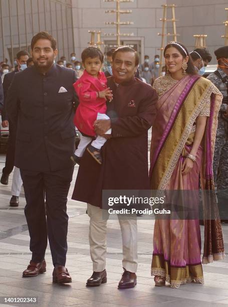 Akash Ambani, Mukesh Ambani and Shloka Mehta Ambani attend the Arangnetram ceremony of Ms. Radhika Merchant on June 05, 2022 in Mumbai, India