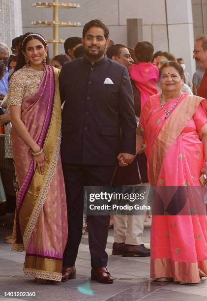 Shloka Mehta Ambani, Akash Ambani and Kokilaben Ambani attend the Arangnetram ceremony of Ms. Radhika Merchant on June 05, 2022 in Mumbai, India