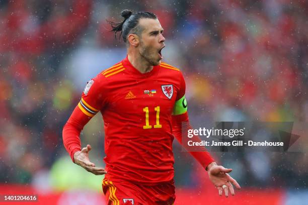 Gareth Bale of Wales celebrates after Andriy Yarmolenko of Ukraine scored an own goal which leads to Wales' first goal during the FIFA World Cup...