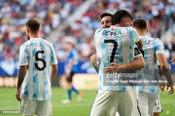 Lionel Messi of Argentina celebrates with his teammates Rodrigo De Paul of Argentina after scoring his team's third goal during the international...