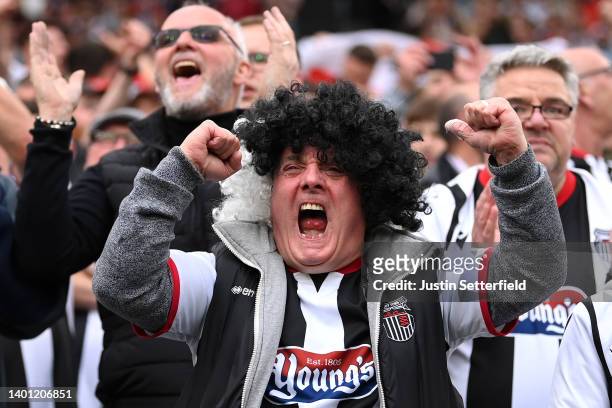 Grimsby fan celebrates after winning the Vanarama National League Final match between Solihull Moors and Grimsby Town at London Stadium on June 05,...