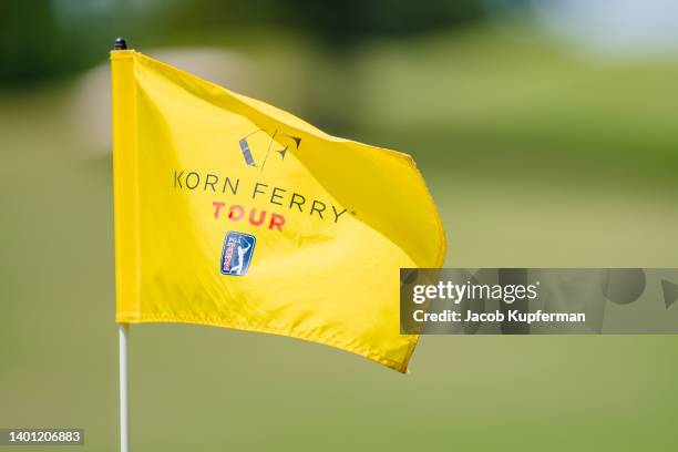 The Korn Ferry Tour logo is displayed on the flag on the ninth hole during the final round of the Korn Ferry Tour REX Hospital Open at The Country...