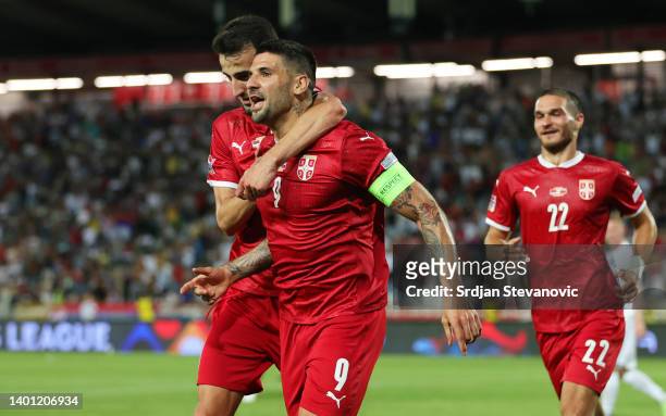Aleksandar Mitrovic of Serbia celebrates with team mate Erhan Masovic after scoring their sides first goal during the UEFA Nations League League B...
