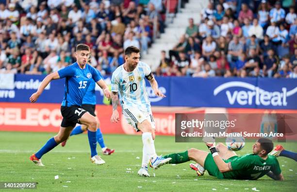 Lionel Messi of Argentina scoring his team's fourth goal during the international friendly match between Argentina and Estonia at Estadio El Sadar on...