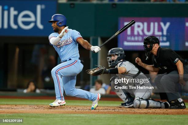 Ezequiel Duran of the Texas Rangers singles for his first major league hit in the second inning against the Seattle Mariners at Globe Life Field on...