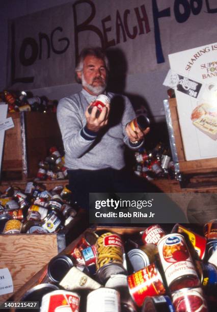 Kenny Rogers stopped by the Long Beach Food bank with donations before he performed in concert, May 9, 1986 at Long Beach Arena in Long Beach,...