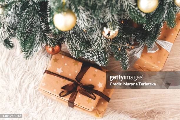 gift under the tree. new year. christmas. christmas decor. christmas tree. christmas background. holiday. - christmas presents under tree stock pictures, royalty-free photos & images