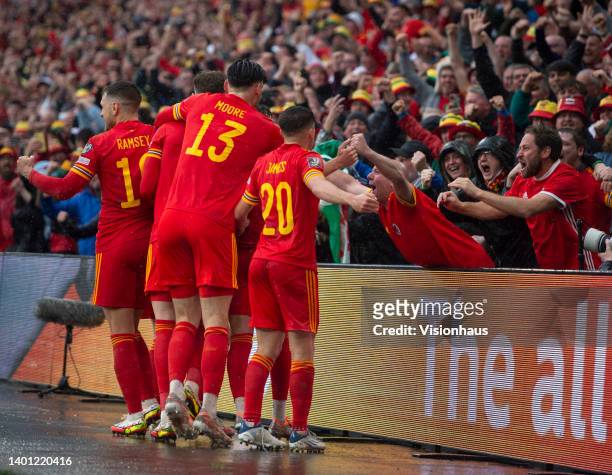 Gareth Bale of Wales celebrates his team's goal with team mates Kieffer Moore, Aaron Ramsey, Neco Williams and Daniel James during the FIFA World Cup...