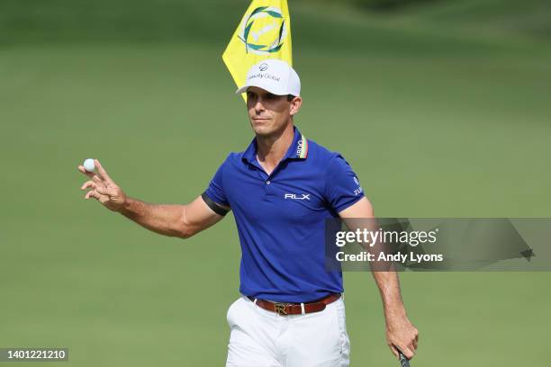 Billy Horschel of the United States celebrates after making a eagle putt on the 15th green during the final round of the Memorial Tournament...