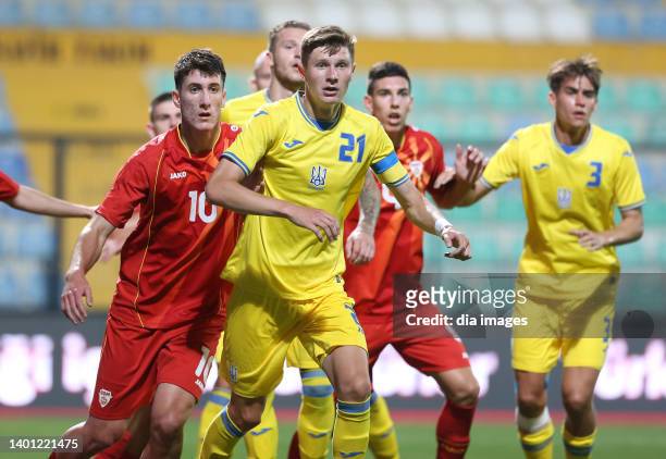 Dmytro Kryskiv of Ukraine in action with Blerton Sheji of North Macedonia during the UEFA Nations League 2023 Final Tournament between Ukraine and...
