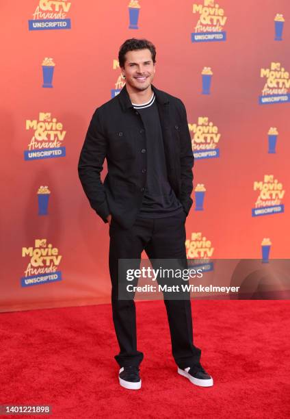 In this image released on June 5, Gleb Savchenko attends the 2022 MTV Movie & TV Awards: UNSCRIPTED at Barker Hangar in Santa Monica, California and...