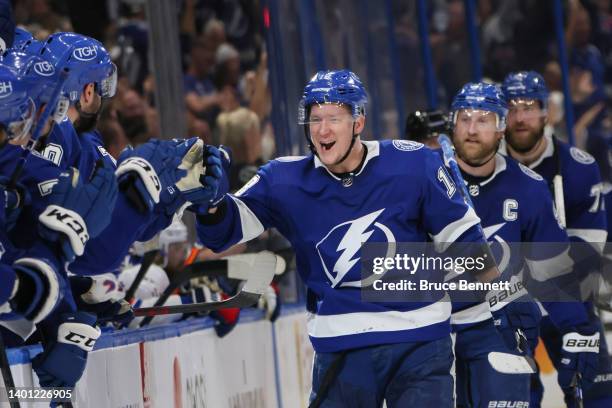 Ondrej Palat of the Tampa Bay Lightning high fives teammates after scoring a goal assisted by Victor Hedman and Nikita Kucherov in Game Three of the...