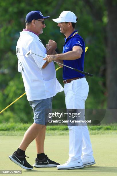 Billy Horschel of the United States celebrates with his caddie Mark Fulcher on the 18th green after winning the Memorial Tournament presented by...