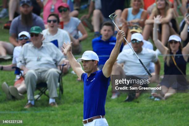Billy Horschel of the United States celebrates after making a eagle putt on the 15th green during the final round of the Memorial Tournament...