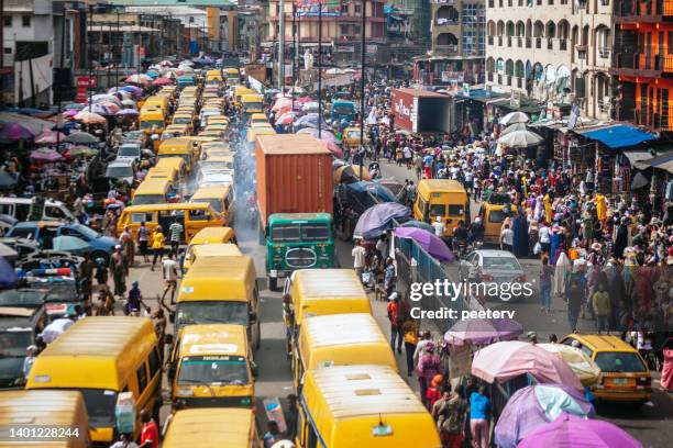 african megacity traffic - lagos, nigeria - commuters overhead view stock pictures, royalty-free photos & images