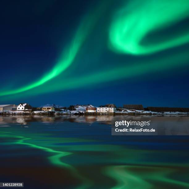 majestic green aurora borealis over harbor of svolvaer, lofoten islands, norway - noorderlicht stockfoto's en -beelden