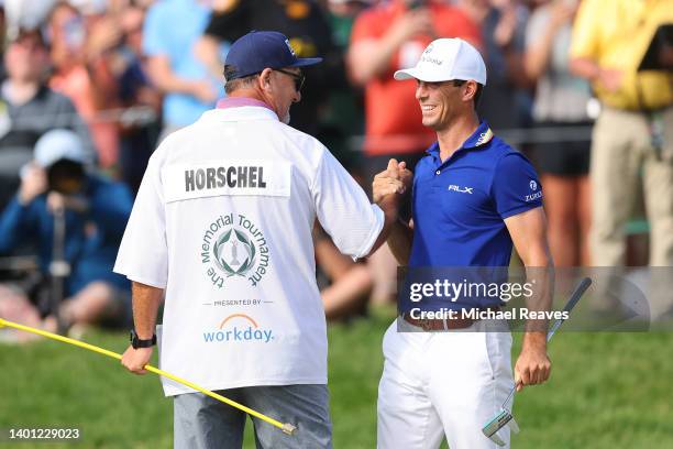 Billy Horschel of the United States celebrates with his caddie Mark Fulcher on the 18th green after winning the Memorial Tournament presented by...