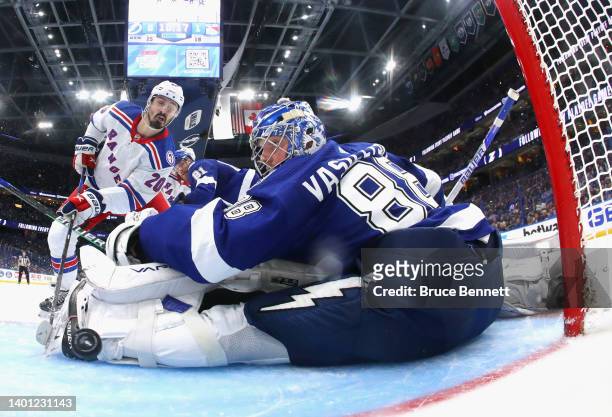 Chris Kreider of the New York Rangers scores a power play goal past Andrei Vasilevskiy of the Tampa Bay Lightning assisted by Artemi Panarin and Mika...