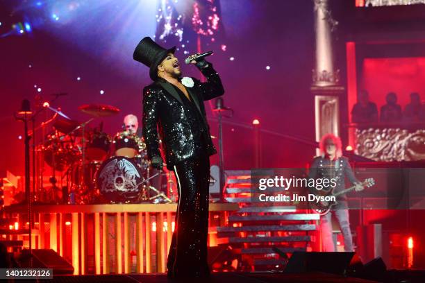 Adam Lambert performs on stage with Brian May and Roger Taylor of Queen, during the Rhapsody tour, at The O2 Arena on June 05, 2022 in London,...
