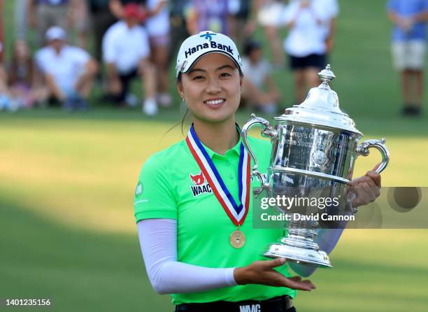 Minjee Lee of Australia holds the trophy after her victory in the final round of the 2022 U.S. Women's Open at Pine Needles Lodge and Golf Club on...