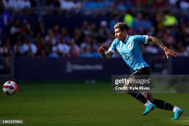 Mathias Olivera of Uruguay knocks the ball away from the United States defense during the second half of the friendly match at Children's Mercy Park...